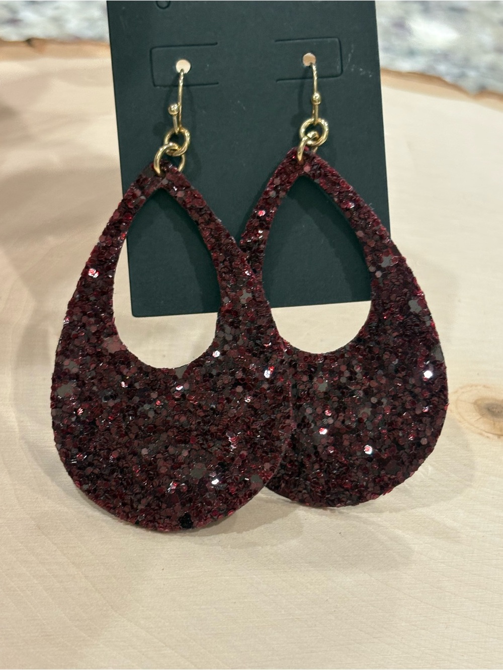 Burgundy glitter tear drop cut out earrings New on card Unbranded